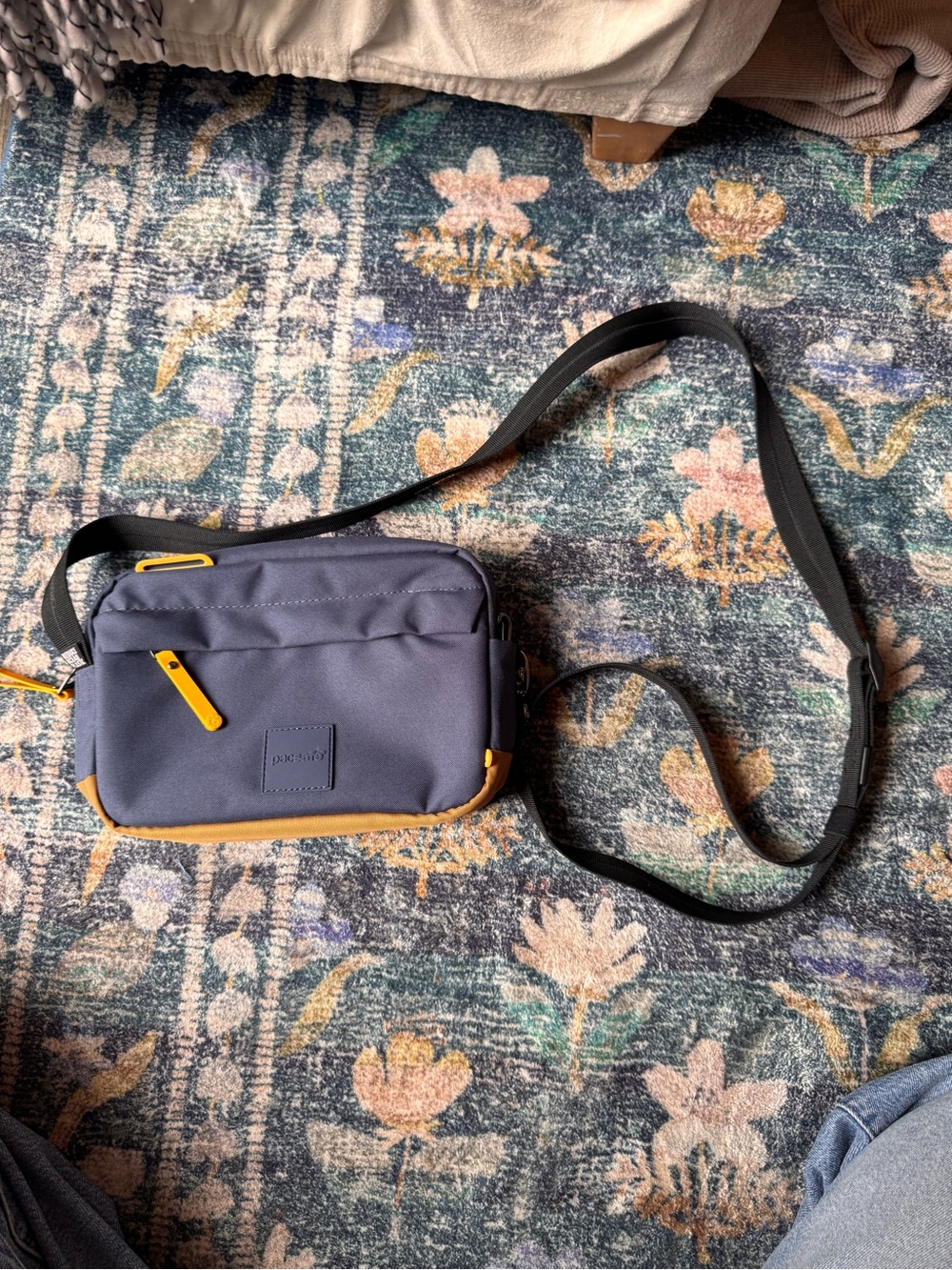 Pacsafe Go Sling Navy Blue Crossbody Bag with Mustard Accents